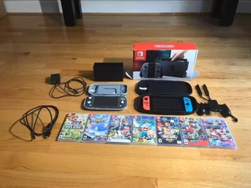 Nintendo Switch Console Bundle +2 joy cons + Portable Switch +7 games +2 cases