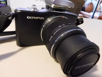Olympus PEN Mini E-PM1 Mirrorless Digital Camera with accessories, lens