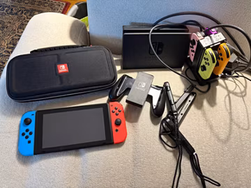 Nintendo Switch Console w/ Red/Blue Joy-Con, Dock, AC Adapter, Case Wi-Fi