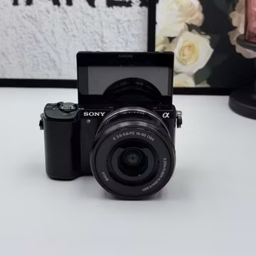 Sony Alpha A5000 Mirrorless Camera w/ 16-50mm lens 20.1MP Tiltable Screen- Black