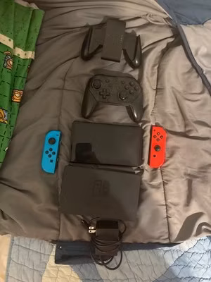 Nintendo Switch – OLED Model w/ Red & Blue Joy-Con w/ Dock and Pro Controller