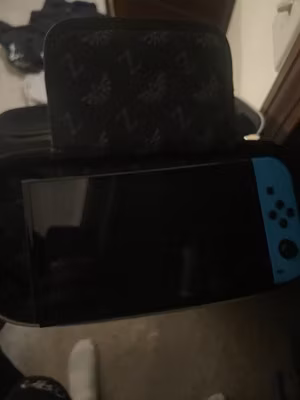 Nintendo Switch Console Black/Blue Joy-Con w/ Zelda Case, Kirby & Smash Bros