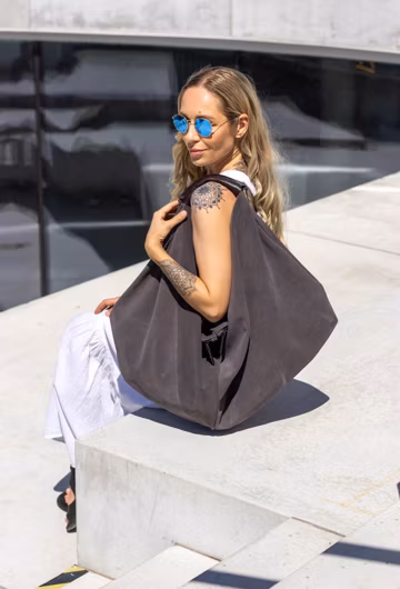 Slouchy suede bag oversized shoulder tote with unlined interior and natural leather handle.
