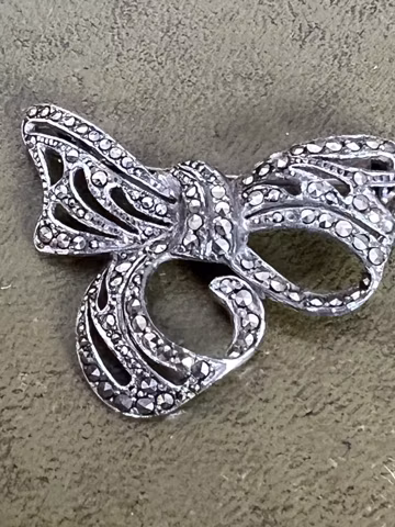 Metal and markesite bow