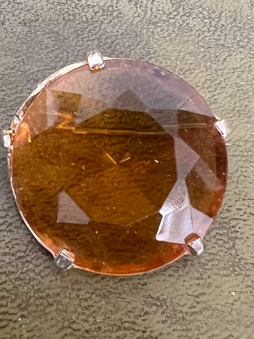 pretty metal and citrine glass brooch
