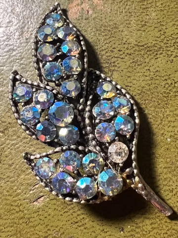 pretty metal and glass brooch
