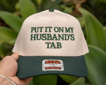 Funny Trucker Hat: "Put It On My Husband's Tab" Embroidered Snapback