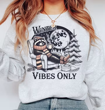 Cozy Winter Raccoon Sweatshirt Chilling Raccoon Design Perfect for Winter Lovers Warm and Fuzzy Apparel Ideal for Raccoon Enthusiasts