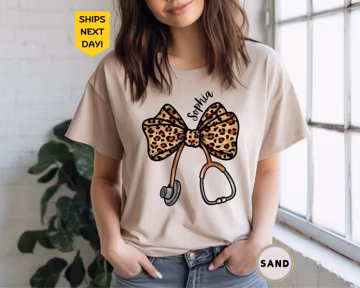 Personalizable Coquette Nurse Shirt, Leopard Print Stethoscope Bow, Healthcare Shirt, Nurse Graduation Shirt, T-Shirt, Gift for Nurse