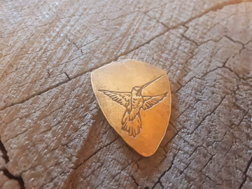bronze guitar pick - playable with hummingbird