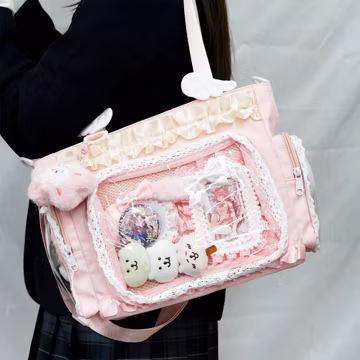 Pink Kawaii Ita Bag, transparent window design perfect for displaying pins. Spacious crossbody tote, ideal gift for anime fans and girls
