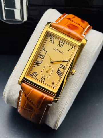 Rare Vintage Seiko Slim Gold Rectangular Seiko wrist watch Brown leather strap, Roman numerals