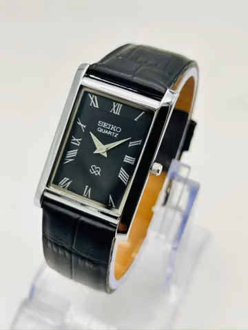 Near Mint Vintage Seiko Quartz Watch:Black Dial, Leather Strap, Slim Tank Dress Style